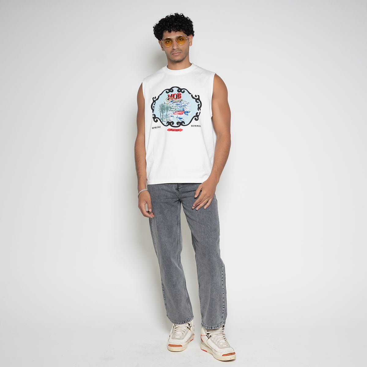 Front full body view of model wearing the Faded Mob Palace Sleeveless T-Shirt by Flashmob Nation.