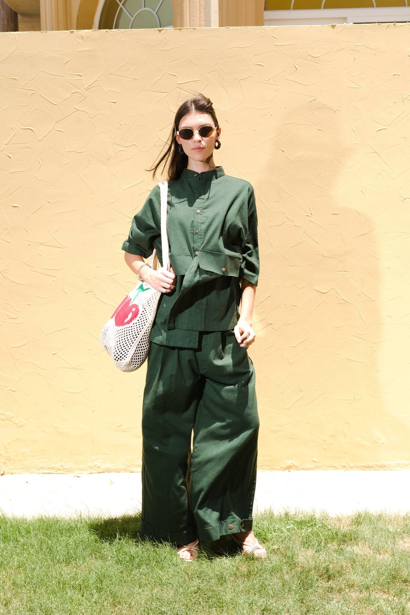 Full length front view of model wearing Women's Linen-Blend Carpenter Pants in Army Green by Flashmob Nation India.