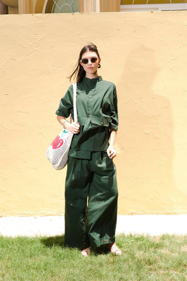 Full length front view of model wearing Women's Linen-Blend Carpenter Pants in Army Green by Flashmob Nation India.